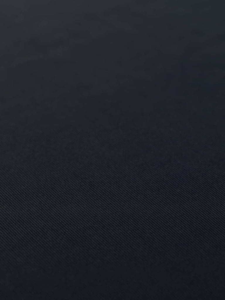 Flat view of Darkest Navy Silken Stretch Rib fabric, showcasing its rich, deep navy color, luxurious sheen, and excellent stretch and drape. This finely knitted jersey fabric is perfect for creating sleek wardrobe essentials.