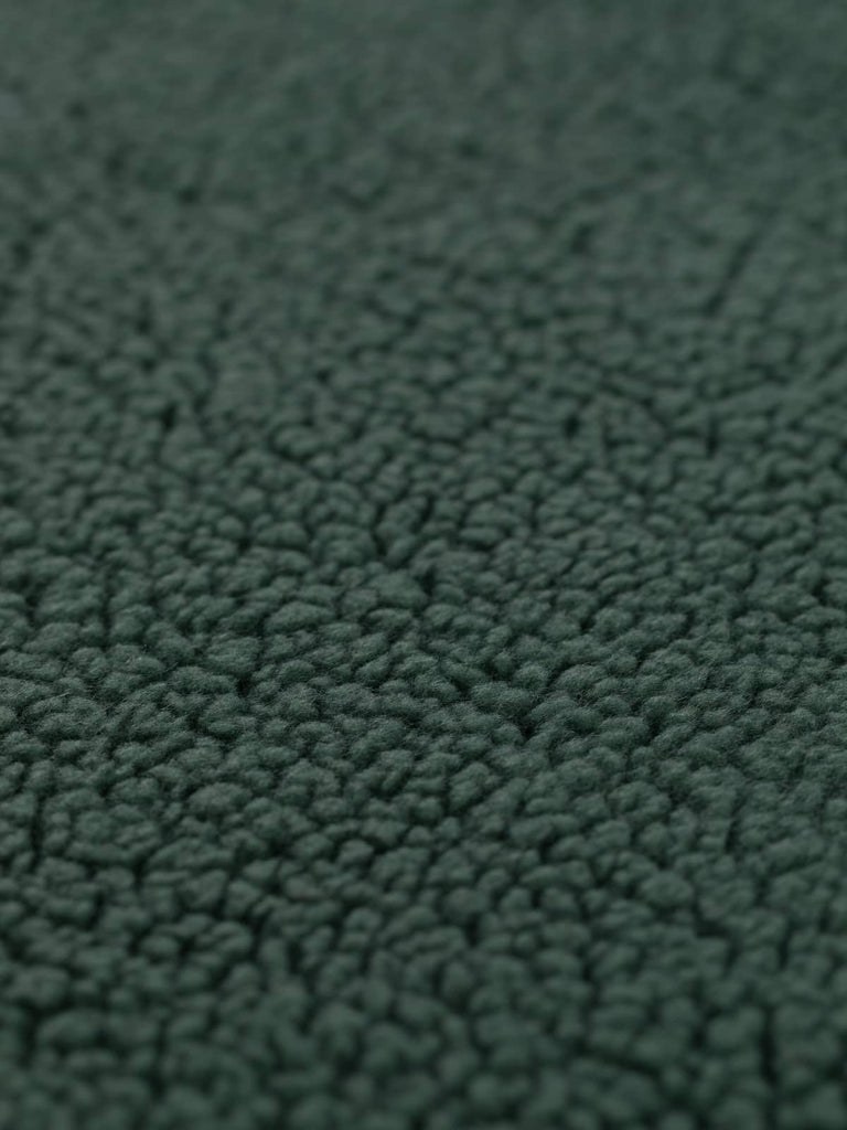 Close-up of the Cosy Sherpa Fleece in Woodland Green, showing its plush texture and soft, moss-like appearance with subtle blue-green tones.