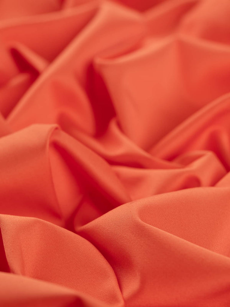 Bright orange sateen cotton fabric 
