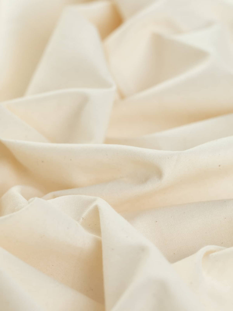 Plain lightweight 100% cotton cream calico perfect for craft projects and home sewing