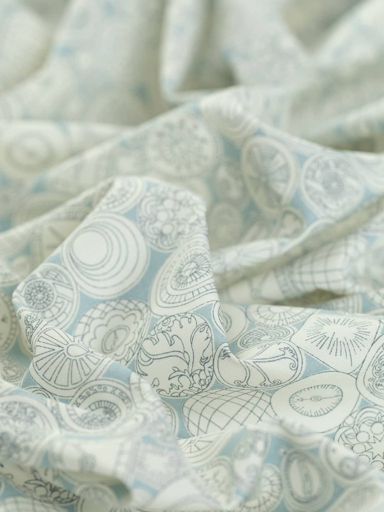 Woven cotton printed fabric with clocks and time pieces for garment sewing