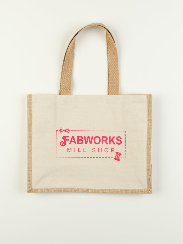 The Fabworks Tote Bag made from durable cotton and jute, showcasing its spacious rectangular shape and sturdy short handles.