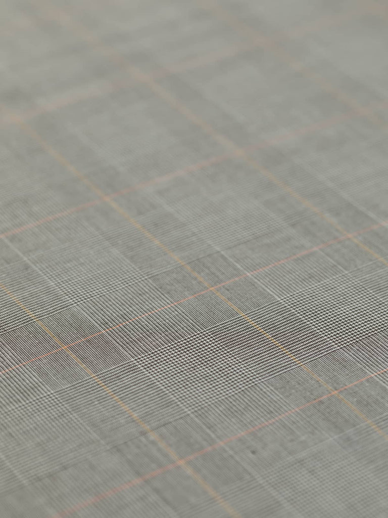 This stretch cotton suiting fabric, Morning Espresso District Check, combines dark espresso brown with accents of yellow and orange over a natural white base. Perfect for autumn/winter wardrobes, it offers stability and a beautiful drape, making it ideal for utility jackets, skirts, and classic trench coats.