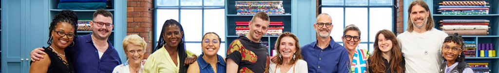 Group of people standing together in a room with books and a window in the background - sewing projects, activewear athleisure . The Great British Sewing Bee. BBC1 channel 1 9pm Tuesdays