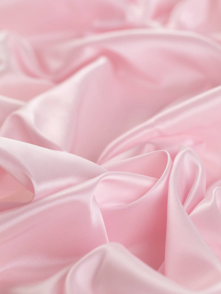 Soft baby pink woven lining fabric, 140cm wide, with a semi-lustrous pearlised finish, very light and silky, ideal for classic tailoring and elegant occasion wear