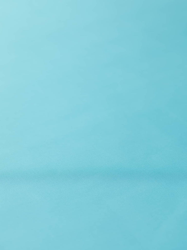 Elegant pastel turquoise fabric with aqua undertones, smooth and drapey, ideal for creating luxurious linings in jackets, skirts, and coats
