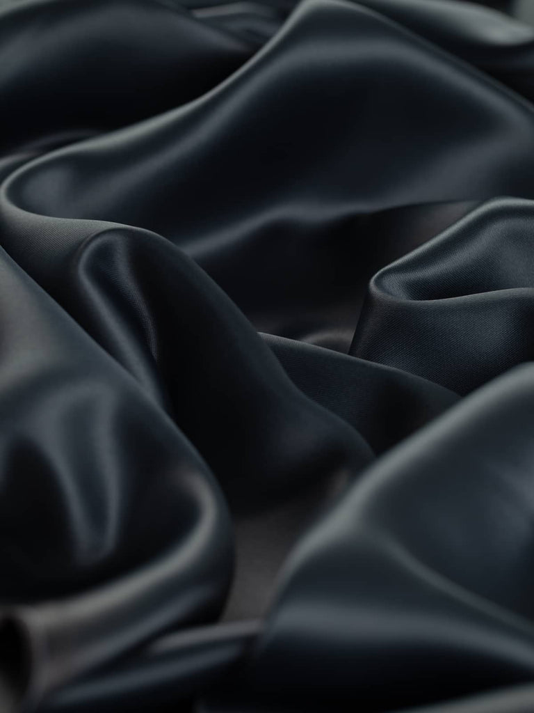 Acetate satin lining fabric in leaden grey color, suitable for jackets, dresses, and coats.