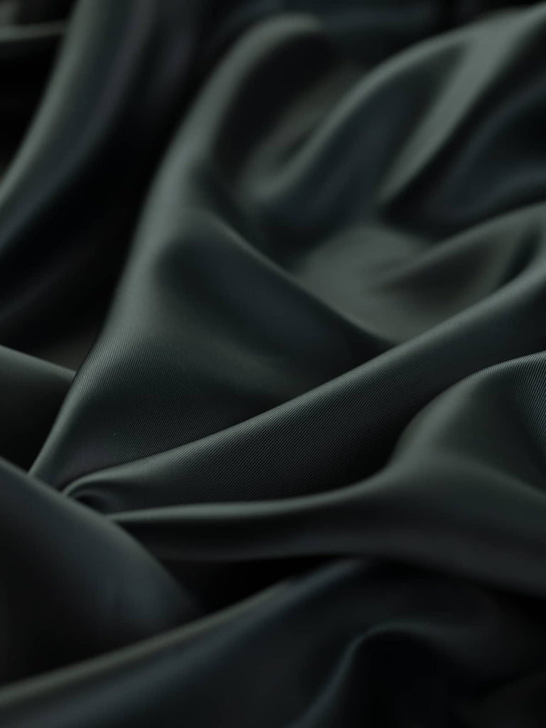 150cm wide Black Pearl silky viscose twill lining fabric, dark grey almost black with a semi-lustrous pearl-like sheen. Ideal for jackets, dresses, and skirts, this lightweight fabric provides a soft, smooth touch and superb drapability.