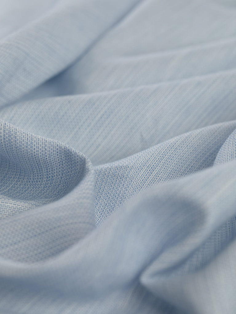 intricately detailed sky blue fabric made of linen and cotton, oxford weave fabric, surplus deadstock available to buy at Fabworks