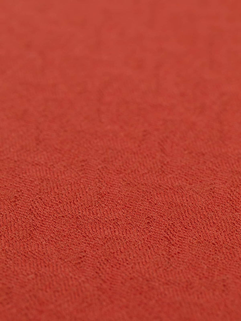 A flat angled view of Autumn Wave fabric showcasing the rhythmic all-over pattern and warm, earthy palette. The fabric’s antiquarian elegance and soft, structured feel are highlighted across the subtly shifting jacquard weave.