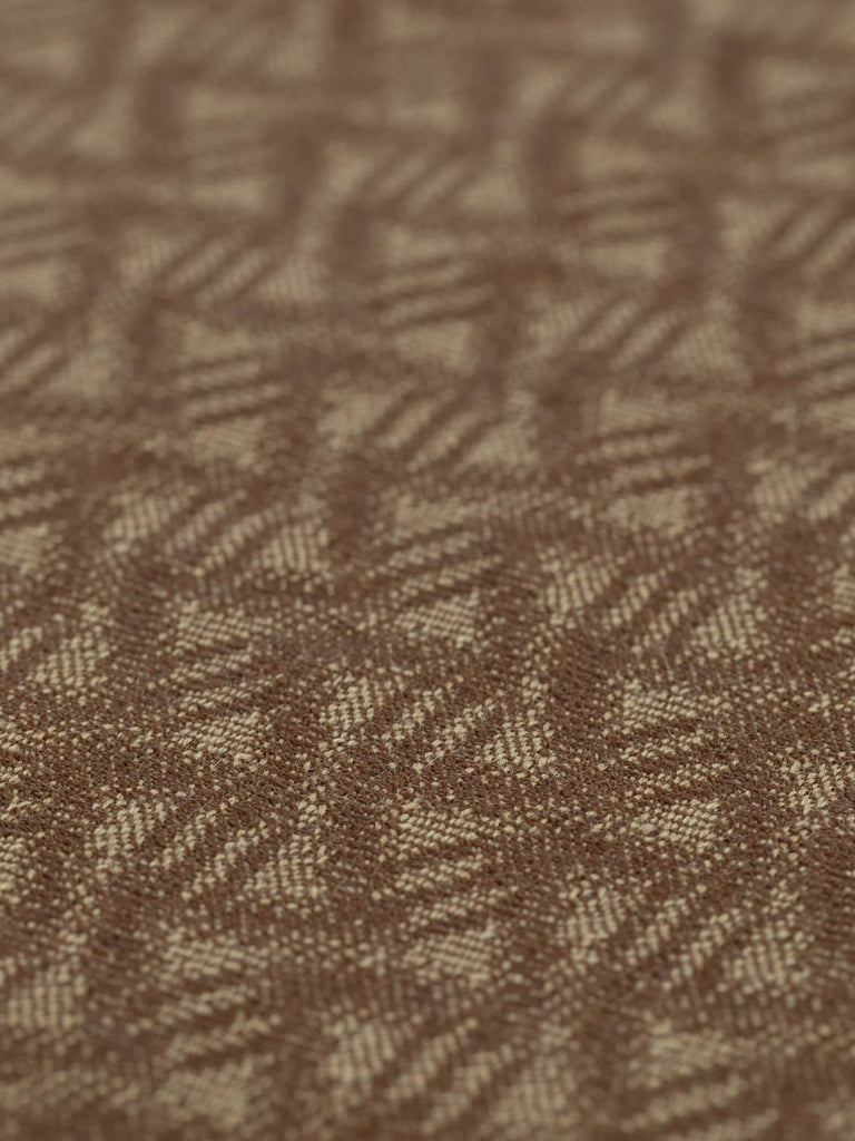 A flat angled view of Cafe Creme Wave fabric, featuring its calm, wave-inspired jacquard pattern. The warm neutral palette and vintage-inspired texture lend a smart, classic look to this versatile fabric.