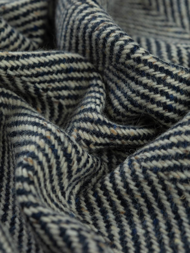 Twist of Nautical Navy Jumbo Herringbone showing soft brushed texture and thick lambswool yarns in navy, white, and flecked tones for cosy winter warmth.