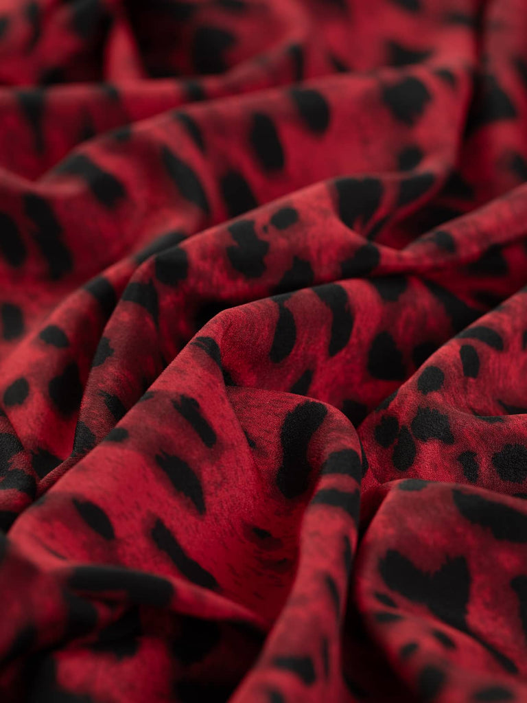 Red and black animal print fabric for clothing 