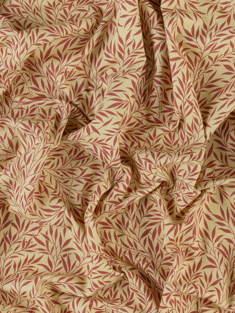 Red leaf print on yellow cream cotton fabric