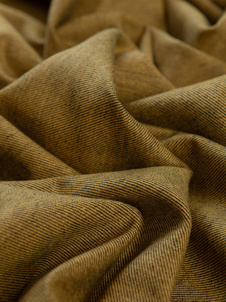 Twist of Mustard Shot 100% Cotton Denim, 370gsm, showing deep navy face interwoven with golden-mustard undertones, highlighting the reversible two-tone effect and firm twill texture.