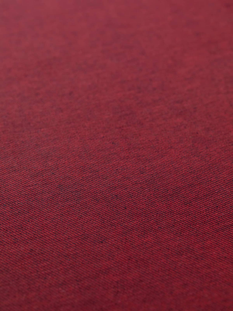 Angled flat view of Raspberry Shot Denim, 166cm wide, revealing its rich blue face with subtle diagonal twill lines and a vibrant pink reverse, creating an elegant contrast with contemporary flair.