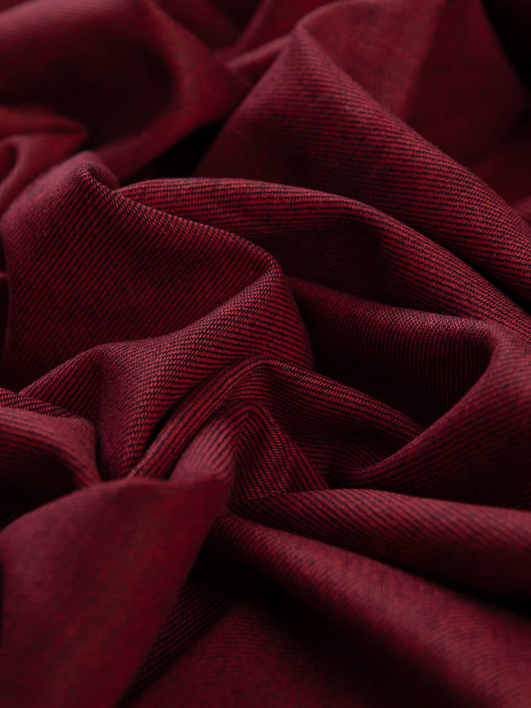 Twist of Raspberry Shot 100% Cotton Denim, 370gsm, showing deep indigo-blue face interwoven with vivid raspberry-pink undertones, highlighting its reversible two-tone weave and crisp twill texture.