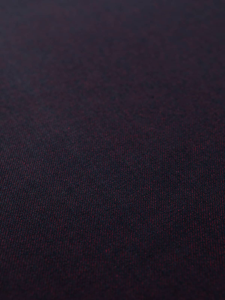 Angled flat view of Raspberry Shot Denim, 166cm wide, revealing its rich blue face with subtle diagonal twill lines and a vibrant pink reverse, creating an elegant contrast with contemporary flair.