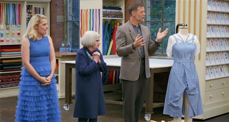 Garment of the week on the Great British Sewing Bee, Season 11 Episode 3 , BBC1 at 9pm. Caz's Dorothy Dress or costume, made in a blue and white woven cotton gingham. Designer style influence, challenge inspired by Donatella and Versace designers.