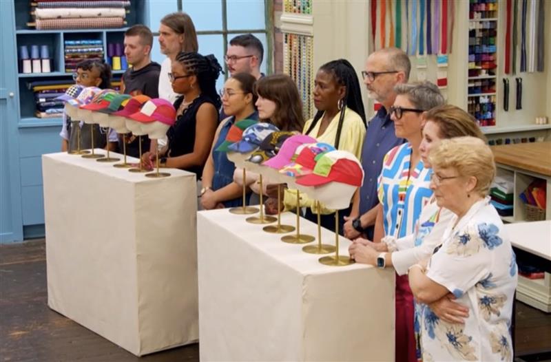 Week 2's contestants lined up in the workroom presenting their colorful hats on mannequins for the pattern challenge
