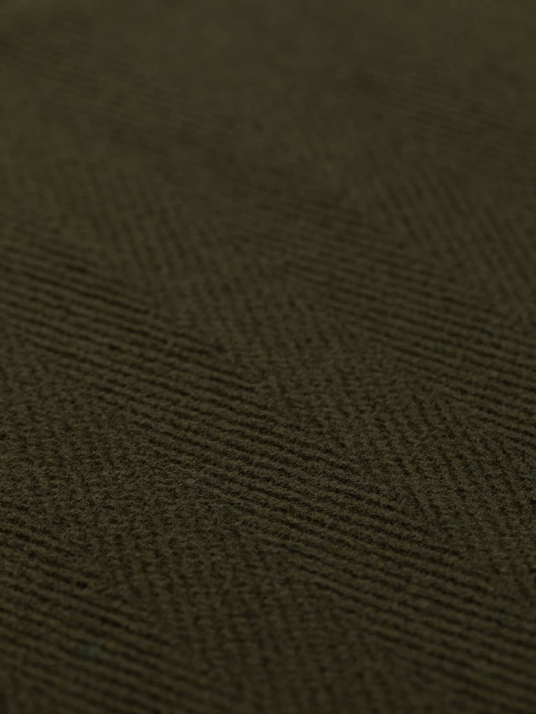 A detailed view of heavyweight wool fabric in a stylish rich green-brown hue, showcasing a 6cm chevron pattern. Ideal for creating sophisticated overcoats, jackets, or classic military-inspired garments, this versatile fabric offers both elegance and durability.