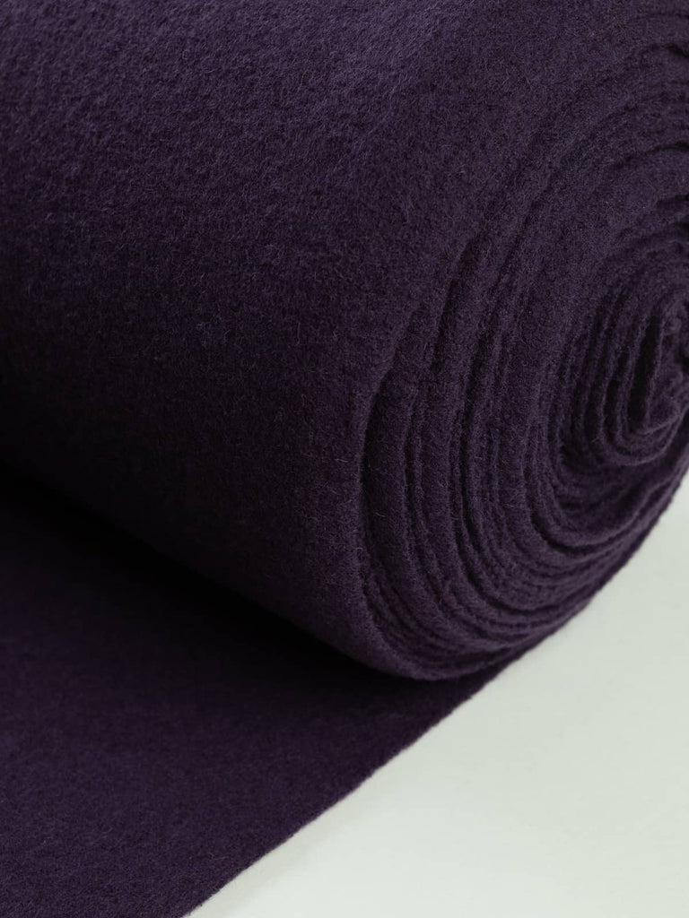 Amethyst Wool Knit, capturing its radiant violet hue inspired by twilight skies and polished amethyst crystal, with fine boucle-knit depth and matte softness.