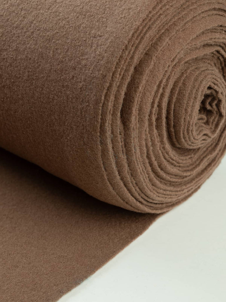 Soft Brown Wool Knit, capturing its warm brown shade inspired by polished wood and autumn tones, with fine boucle-knit depth and matte finish.