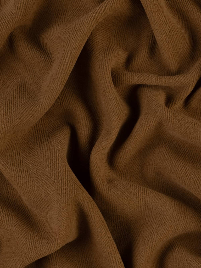 Image of a classic tan wool fabric featuring a 6cm herringbone pattern. The dense, felted texture is perfect for creating chic winter coats, timeless duffle coats, or traditional field jackets.