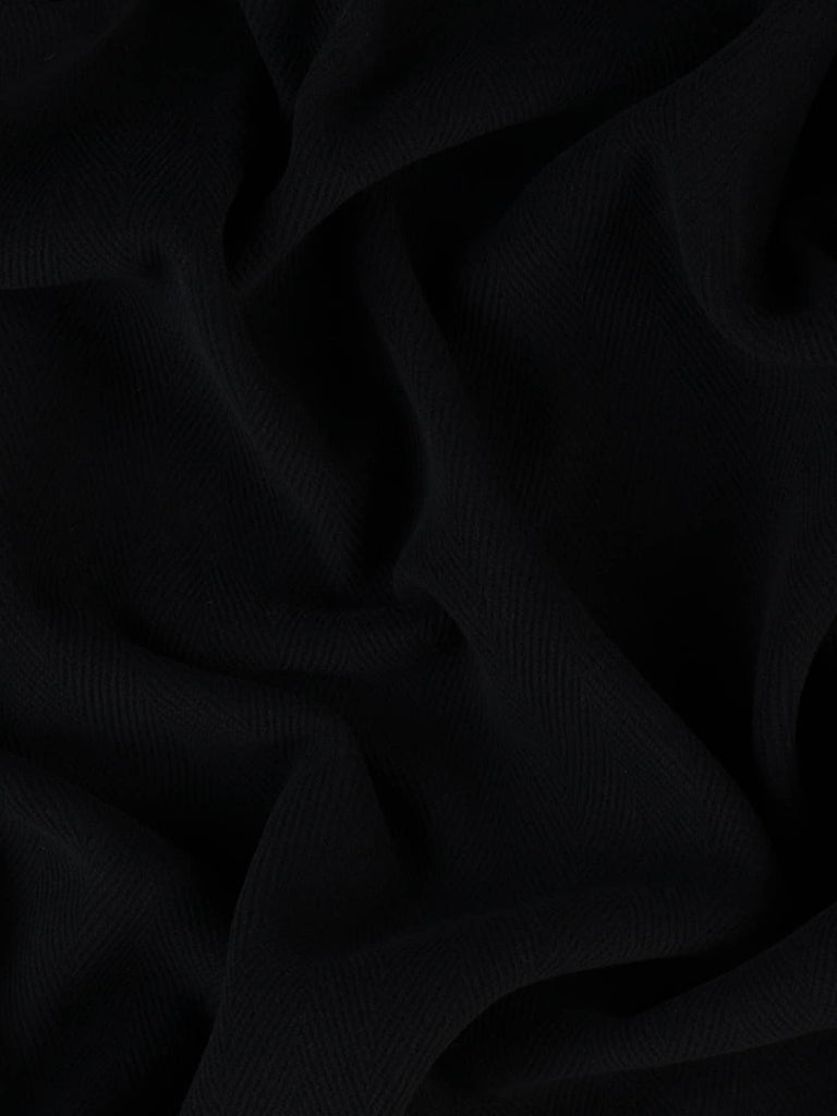 Image of a classic navy blue wool fabric showcasing the bold 6cm chevron design. This densely felted, heavyweight fabric is ideal for making refined winter coats, duffle coats, and traditional worker jackets.