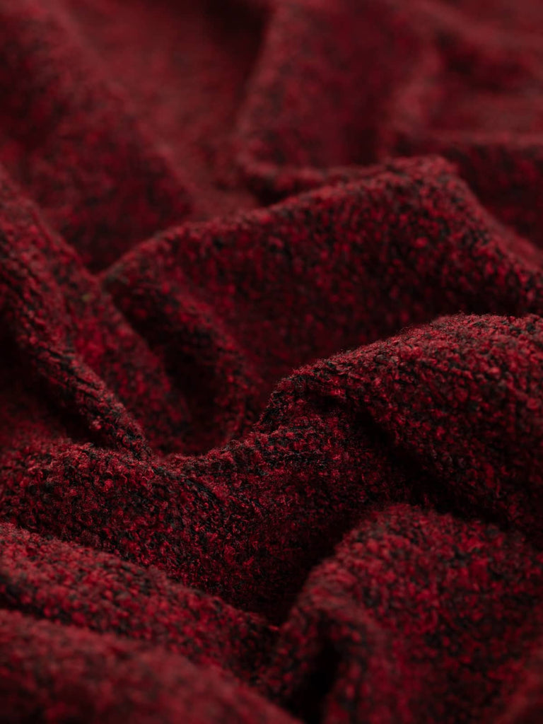 Heavyweight boucle fabric for furnishing & upholstery. Dark wine red ruby colourway. Available to buy for home furnishing projects.